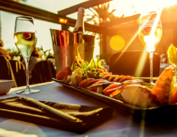 beautiful natural lighting seafood dniner and wine