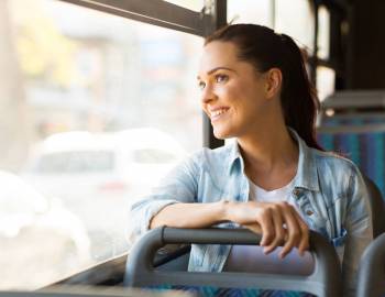 A smiling woman riding the Breeze Trolley around Hilton Head Island