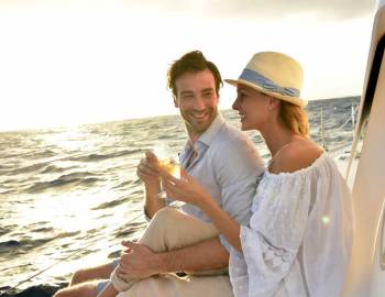 Newlyweds enjoying a boat ride on their honeymoon to Hilton Head Island
