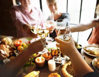 A family raising a glass and dining at one of Hilton Head Island's finest restaurants