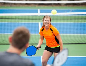 A couple playing pickleball on Hilton Head Island