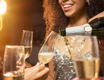 People celebrating New Year's Eve on Hilton Head Island, pouring champagne