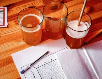 Beer and a graded trivia sheet at trivia night at a Hilton Head bar