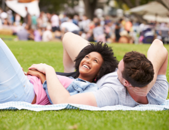 Couple relaxing at event.