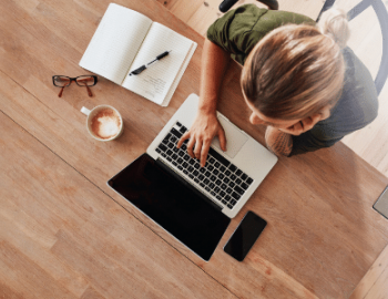 woman working remotely with coffee