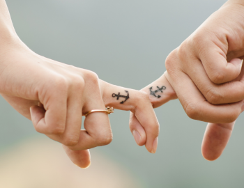 Couple with matching anchor tattoos