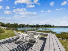 The deck with an amazing water view at a vacation rental from Beach Properties of Hilton Head