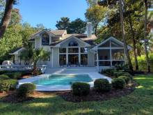 The view of the backyard and the pool of a vacation home rental on Hilton Head Island