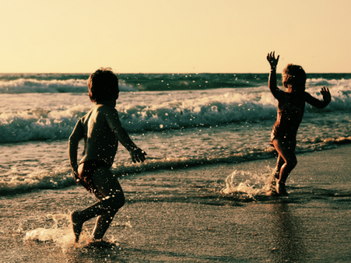 kids playing on the beach kids playing on the beach